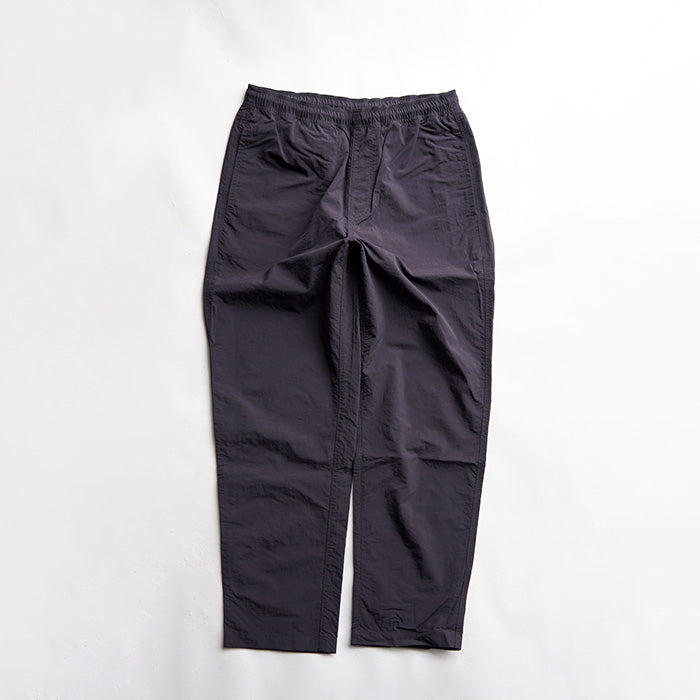 MADE WARM UP NYLON PANTS
