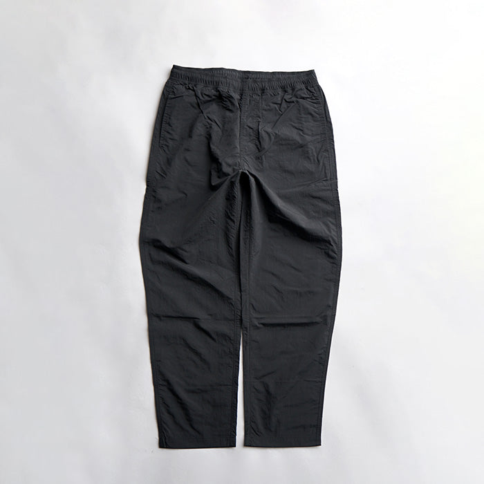MADE WARM UP NYLON PANTS