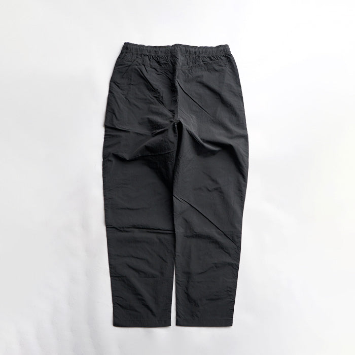 MADE WARM UP NYLON PANTS