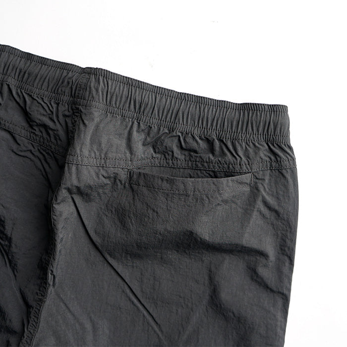 MADE WARM UP NYLON PANTS